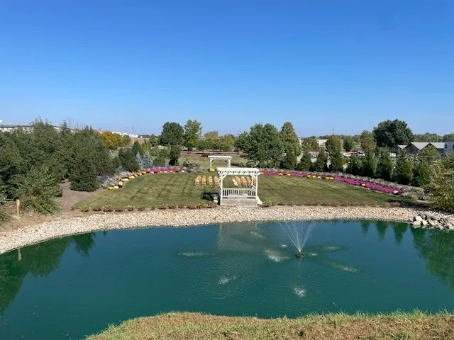 Landscaped garden pond with fountain and gazebo